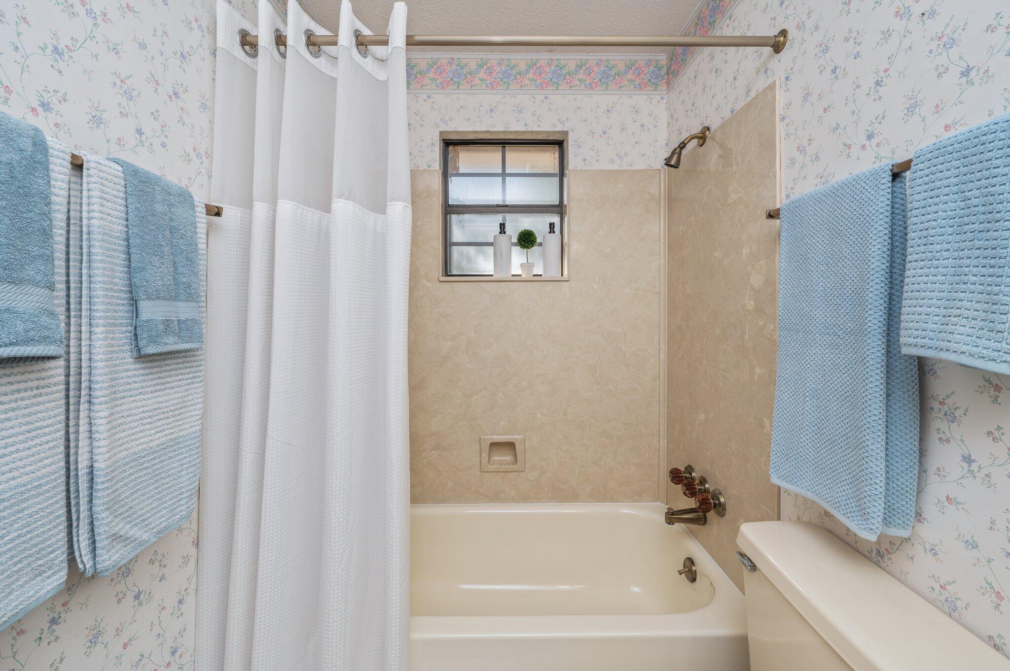 5836 Dairy Road Baker, FL 32531 - Photo 43 of 65 a bathroom with a bathtub and shower