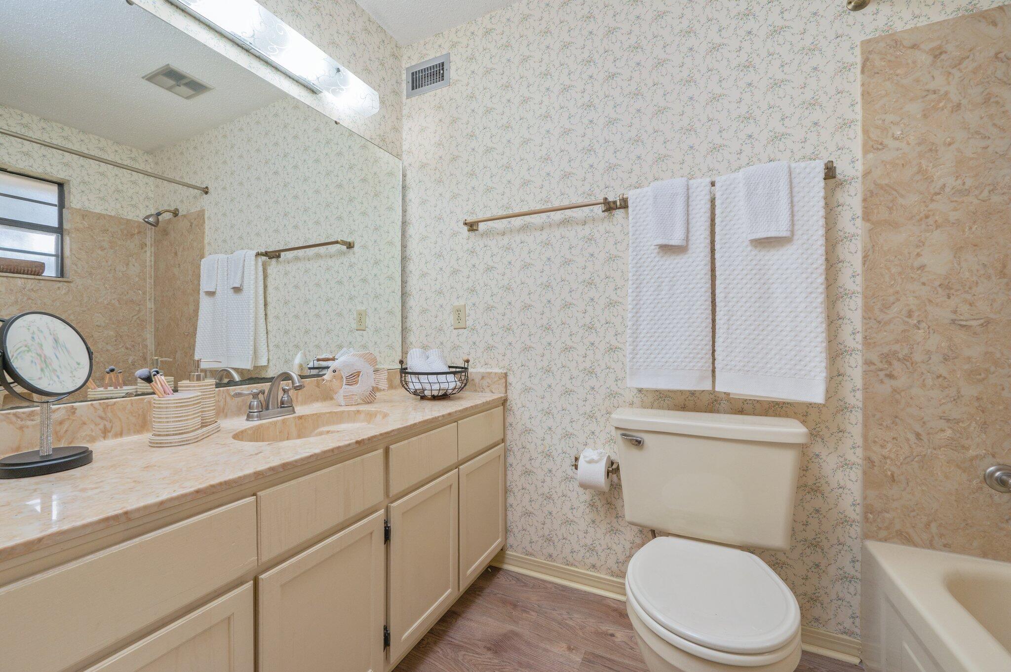 5836 Dairy Road Baker, FL 32531 - Photo 46 of 65 a bathroom with a toilet sink vanity granite and shower