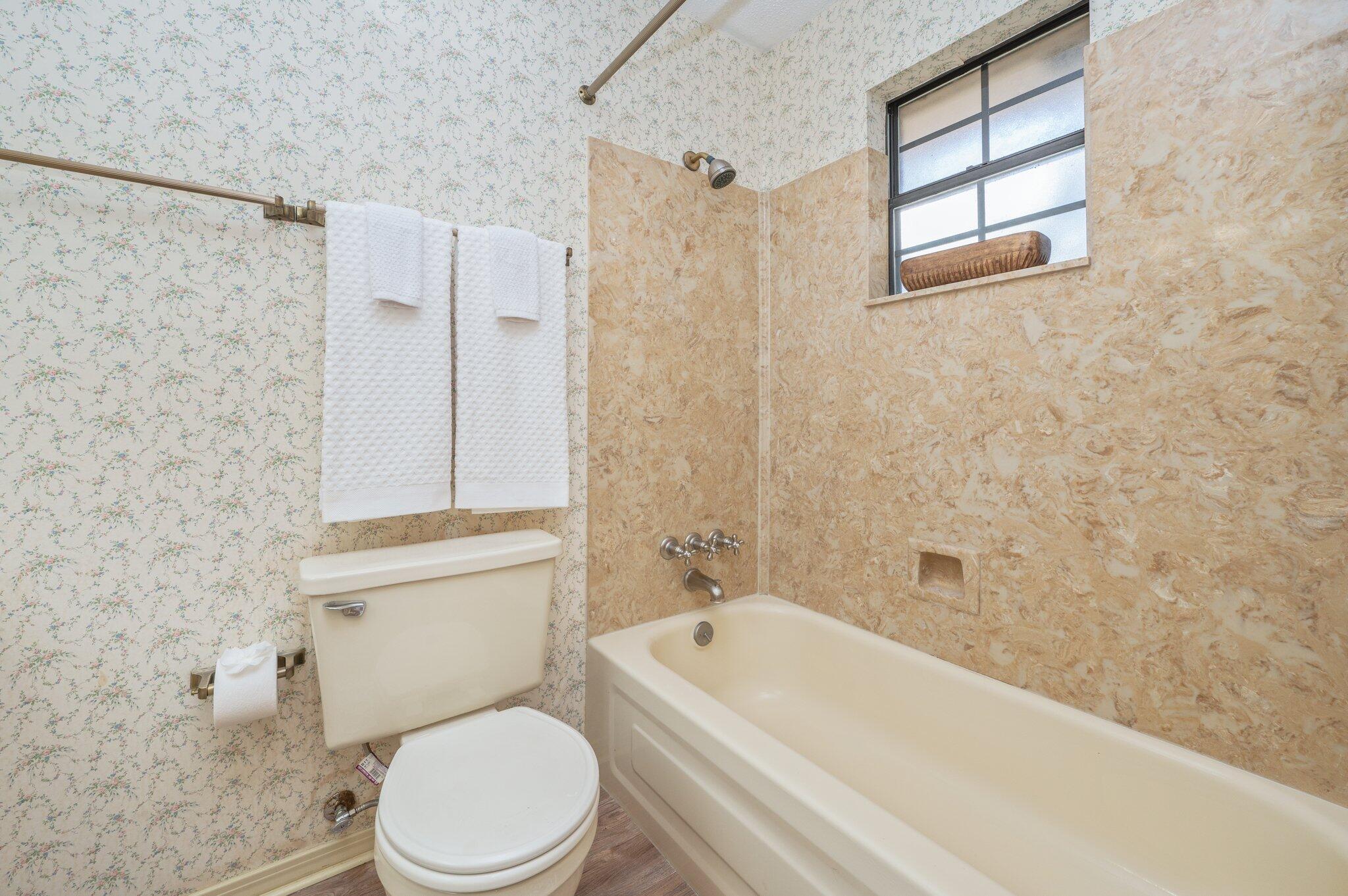 5836 Dairy Road Baker, FL 32531 - Photo 47 of 65 a bathroom with a toilet and a bathtub