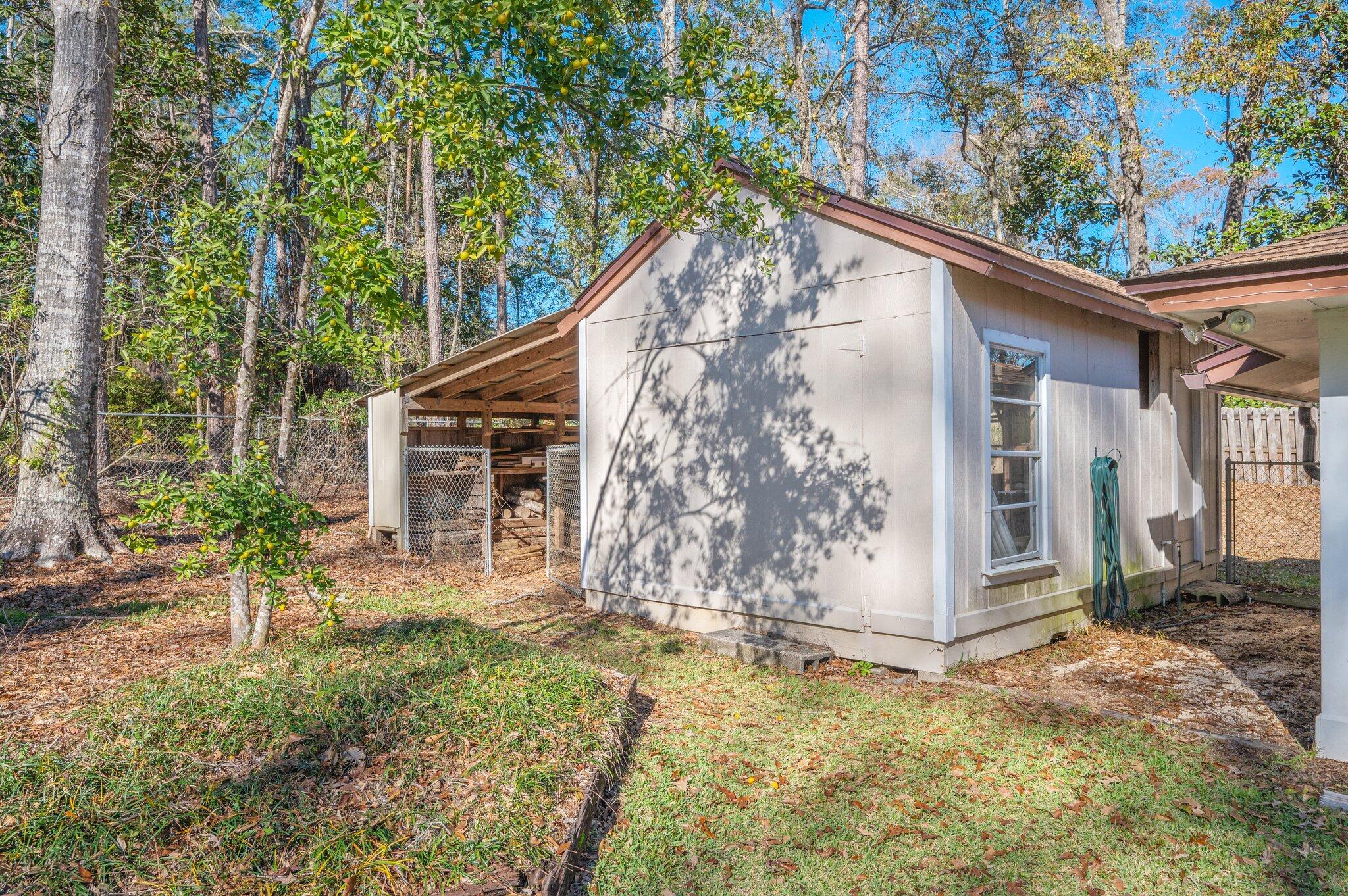 5836 Dairy Road Baker, FL 32531 - Photo 55 of 65 a backyard of a house with table and chairs