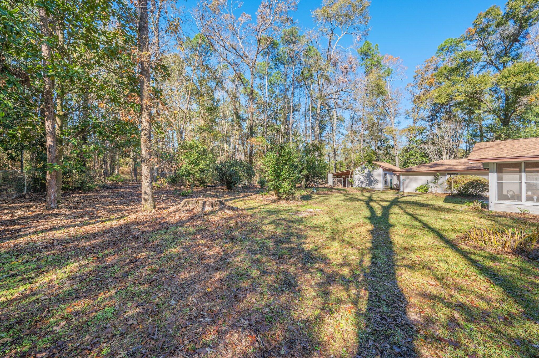 5836 Dairy Road Baker, FL 32531 - Photo 58 of 65 a view of a yard with swimming pool