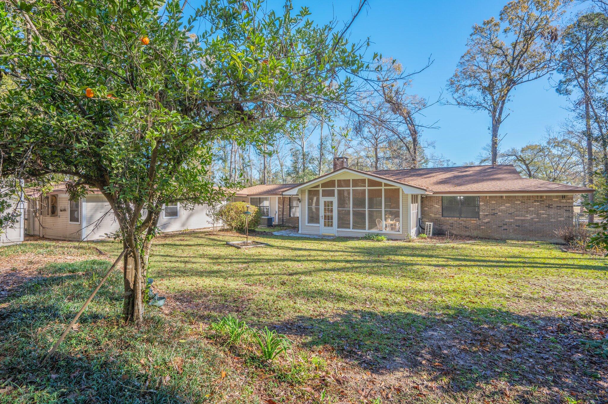 5836 Dairy Road Baker, FL 32531 - Photo 59 of 65 a front view of a house with a yard