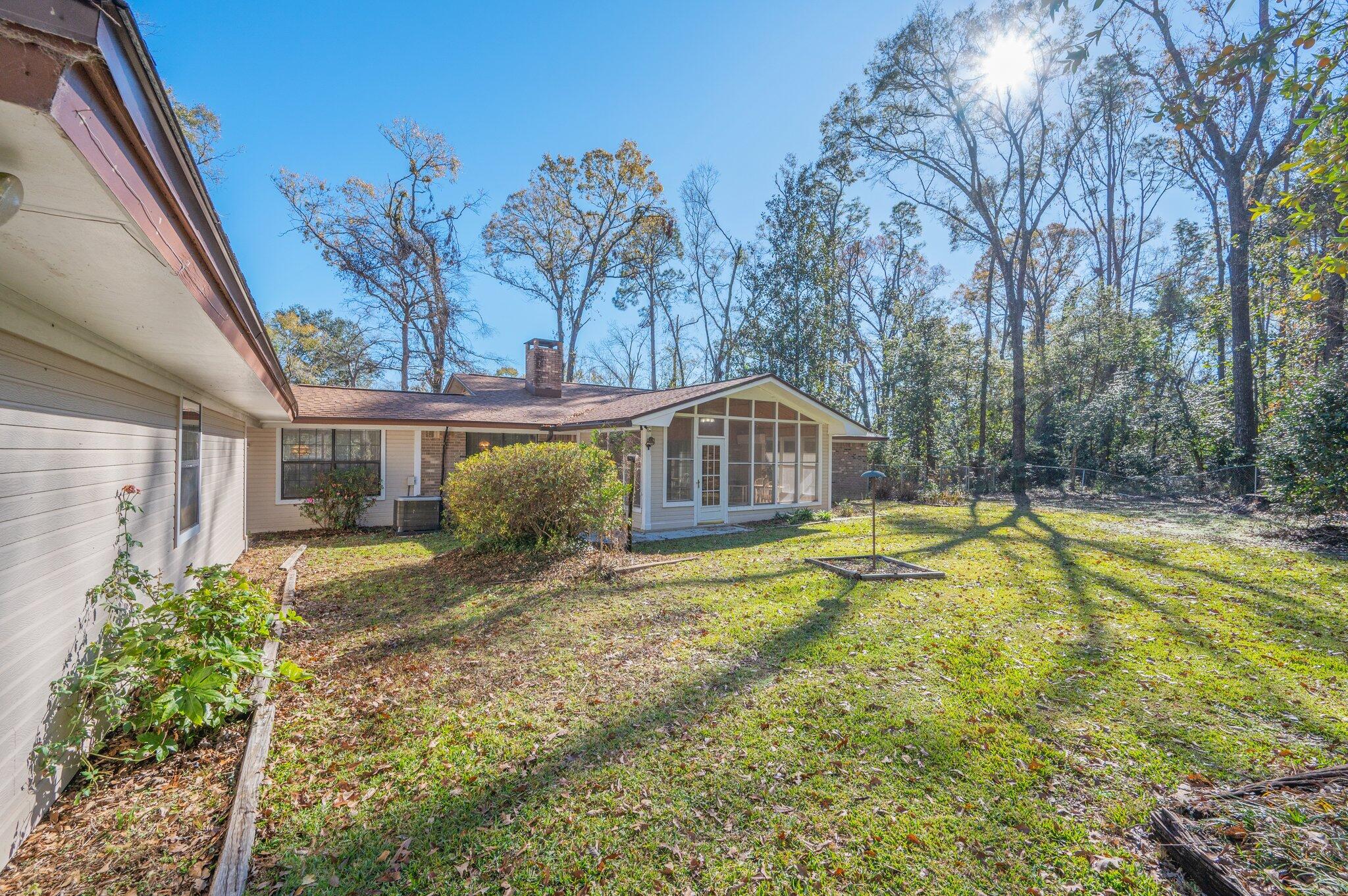 5836 Dairy Road Baker, FL 32531 - Photo 61 of 65 a view of a house with swimming pool