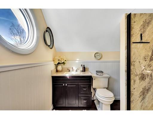 38 Windsor Avenue Acton, MA 01720 - Photo 16 of 30 a bathroom with a toilet a sink and a mirror