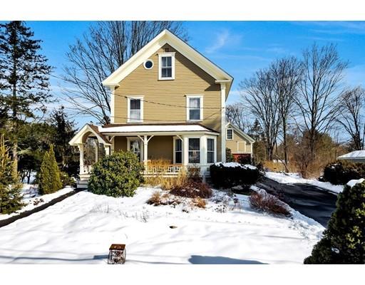 38 Windsor Avenue Acton, MA 01720 - Photo 24 of 30 a front view of a house with a yard covered in snow