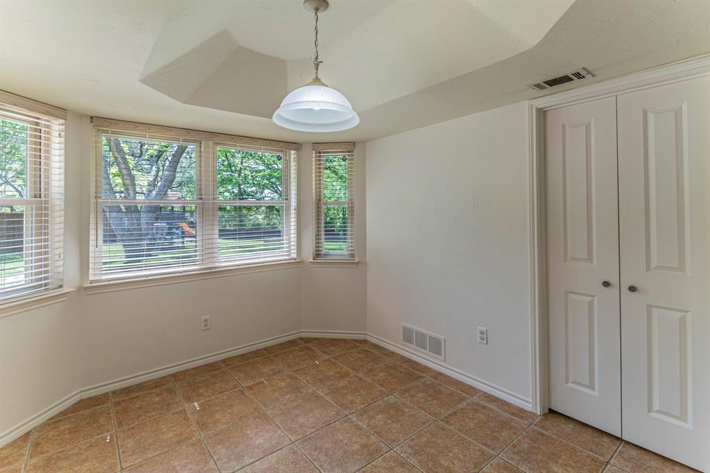 127 Nicklaus Nook Lancaster, TX 75146 - Photo 12 of 37 Unfurnished dining area with baseboards