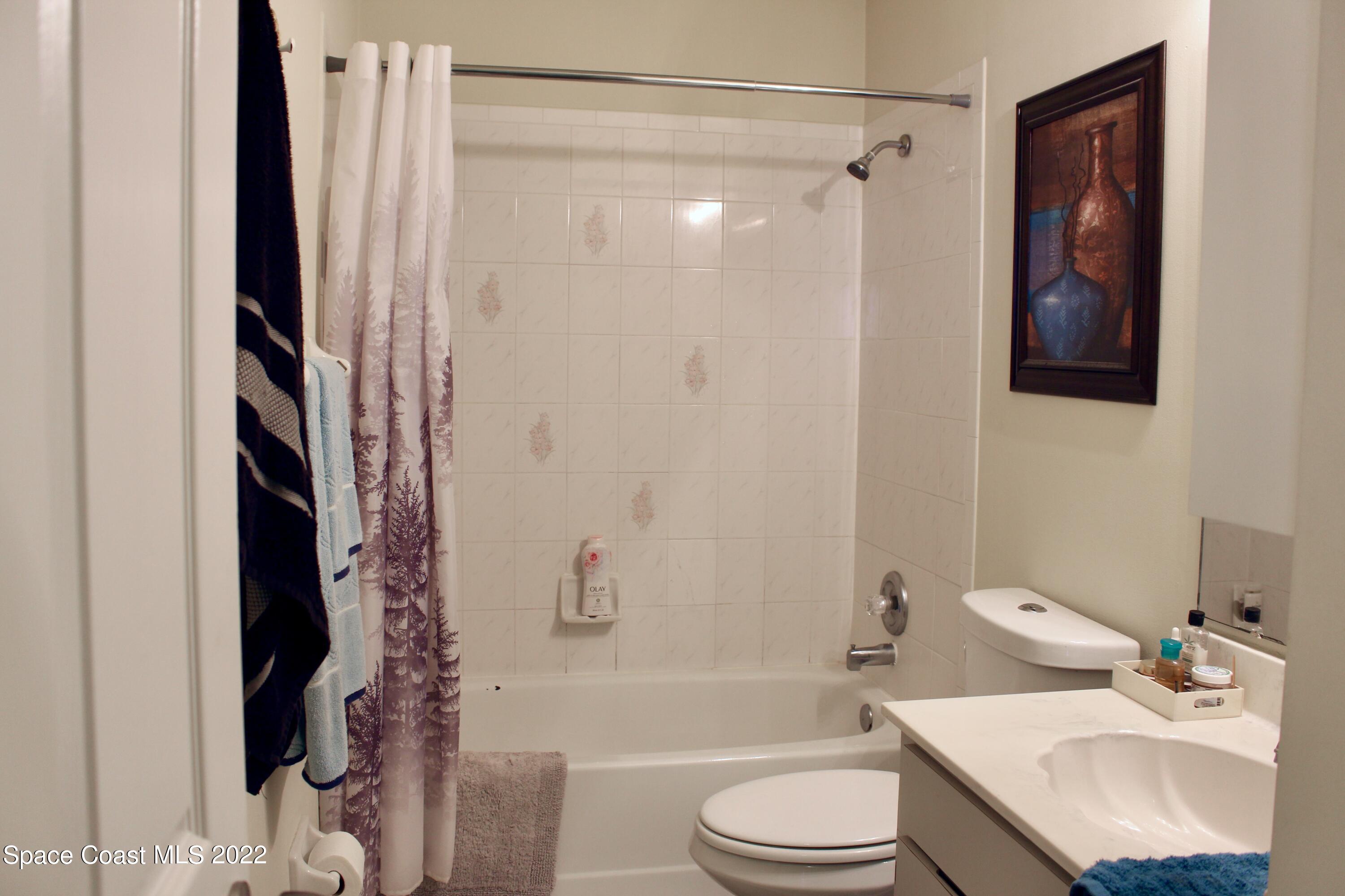 6737 Cecil Road Cocoa, FL 32927 - Photo 17 of 39 a bathroom with a sink toilet and shower