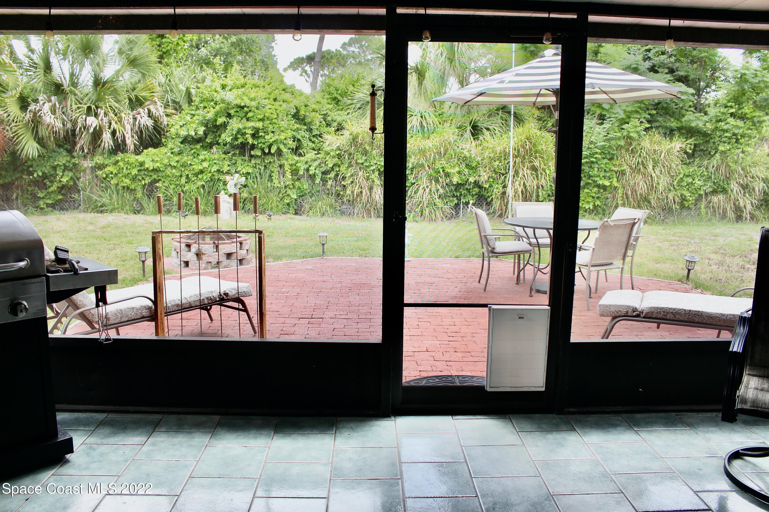 6737 Cecil Road Cocoa, FL 32927 - Photo 28 of 39 a view of a back yard from a balcony