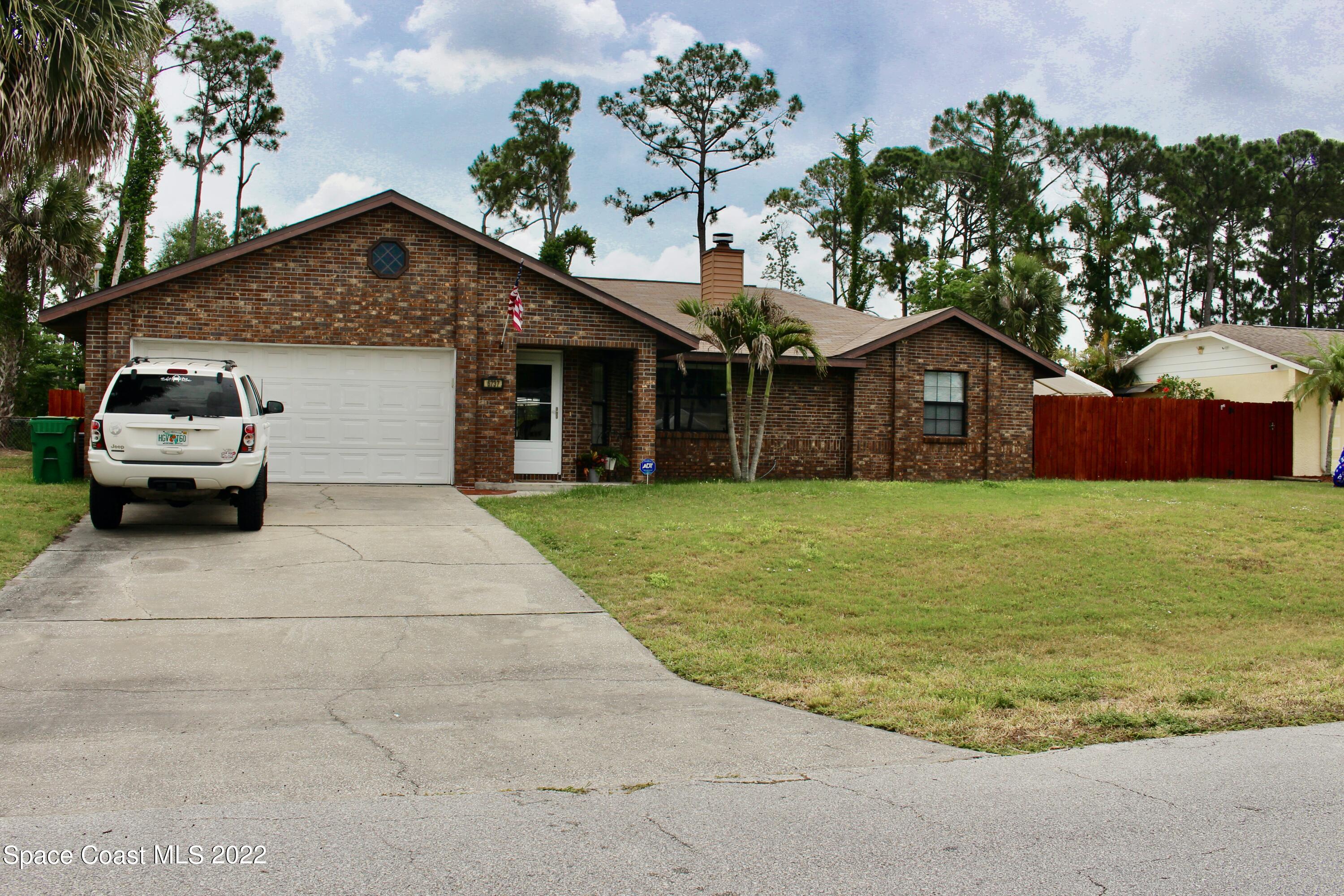 6737 Cecil Road Cocoa, FL 32927 - Photo 3 of 39 a front view of house with yard