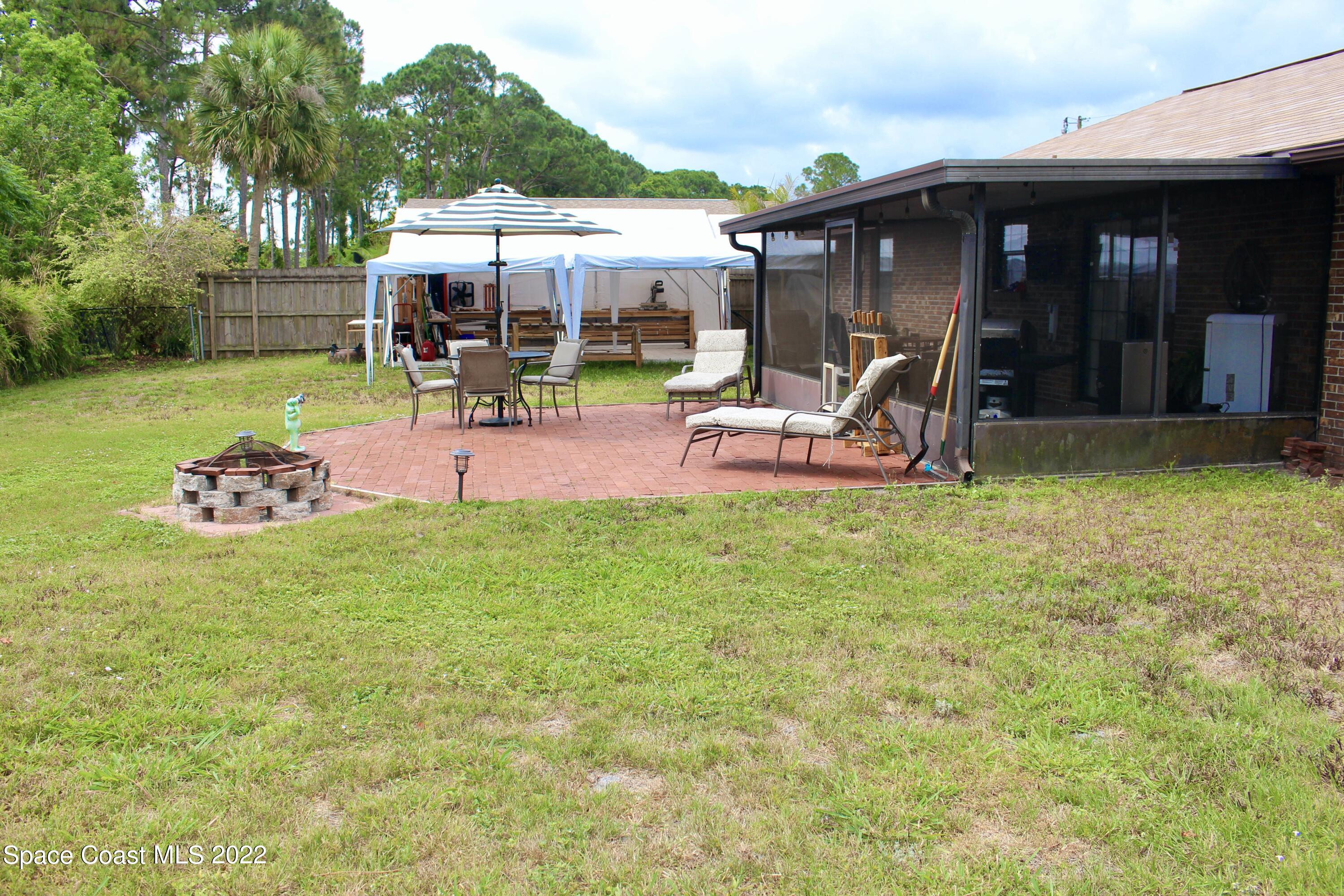 6737 Cecil Road Cocoa, FL 32927 - Photo 33 of 39 a view of a house with backyard porch and furniture