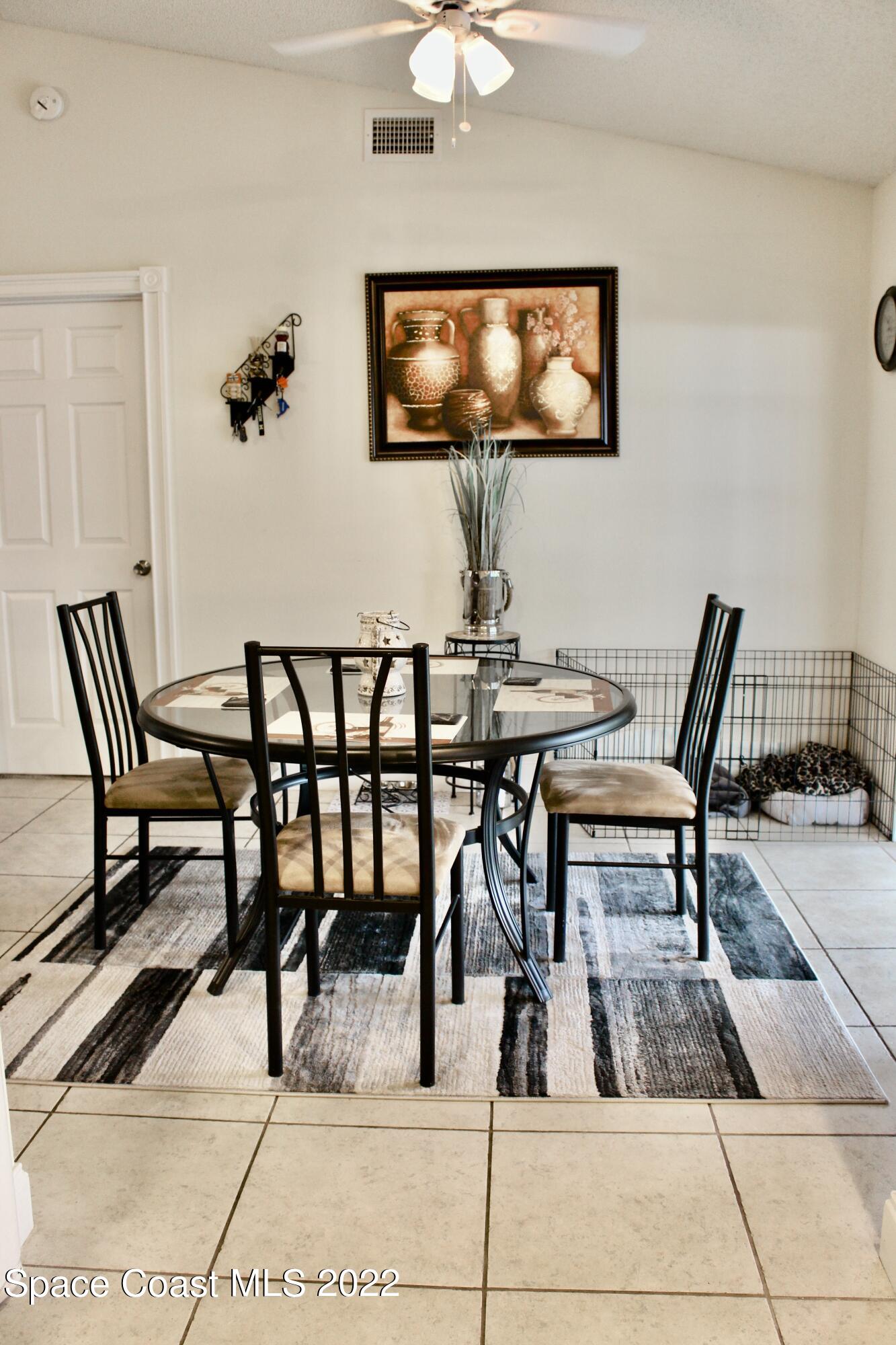 6737 Cecil Road Cocoa, FL 32927 - Photo 5 of 39 a view of a dining room with furniture and wooden floor