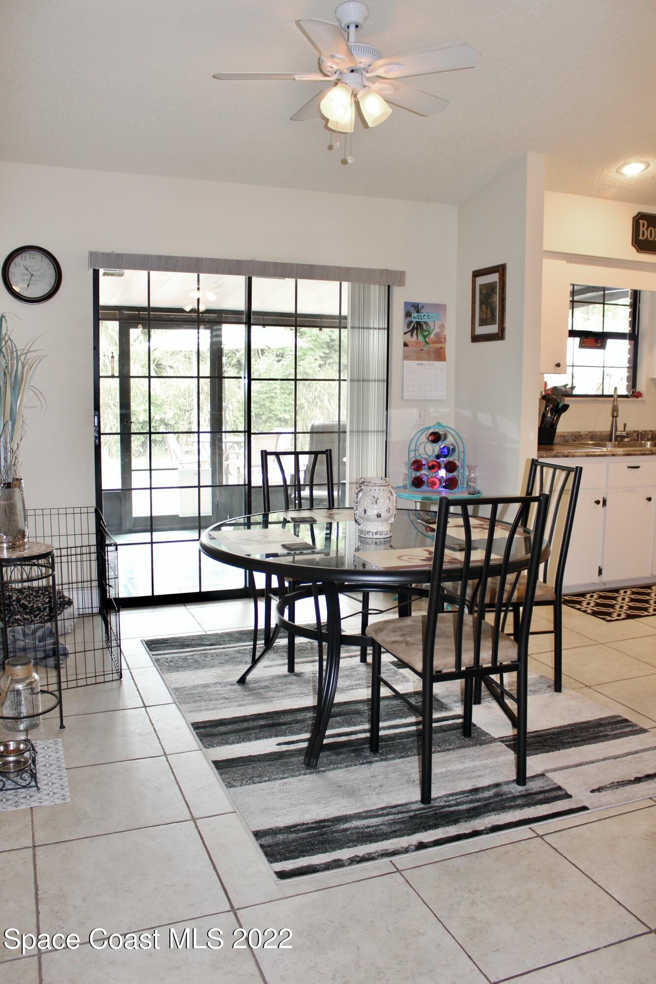 6737 Cecil Road Cocoa, FL 32927 - Photo 6 of 39 a view of a dining room with furniture window and outside view