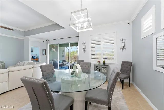 a dining room with furniture and windows