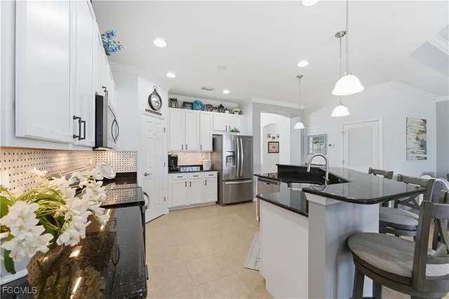 a kitchen with furniture and a table