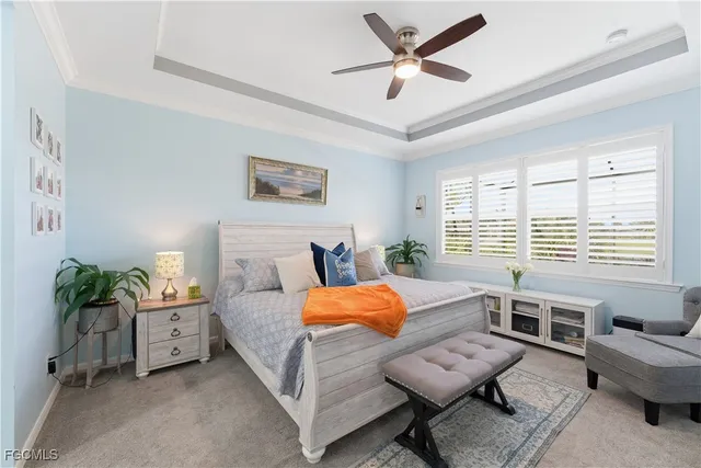 a bedroom with furniture and a large window