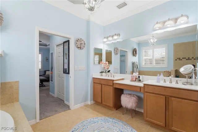 a spacious bathroom with a double vanity sink mirror and toilet