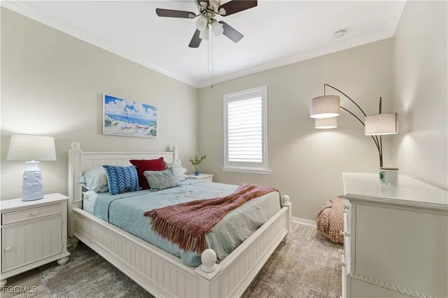 a bedroom with a bed and a night stand