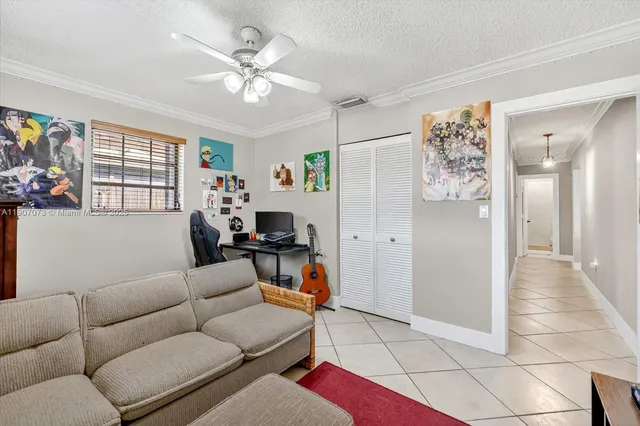 a living room with furniture and a window