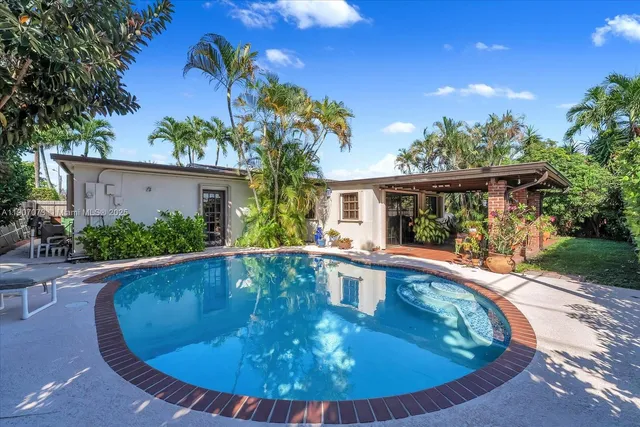 a view of a swimming pool with a patio