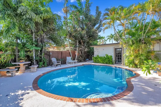 a view of a swimming pool with a patio