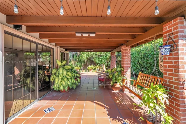 a view of yard with patio