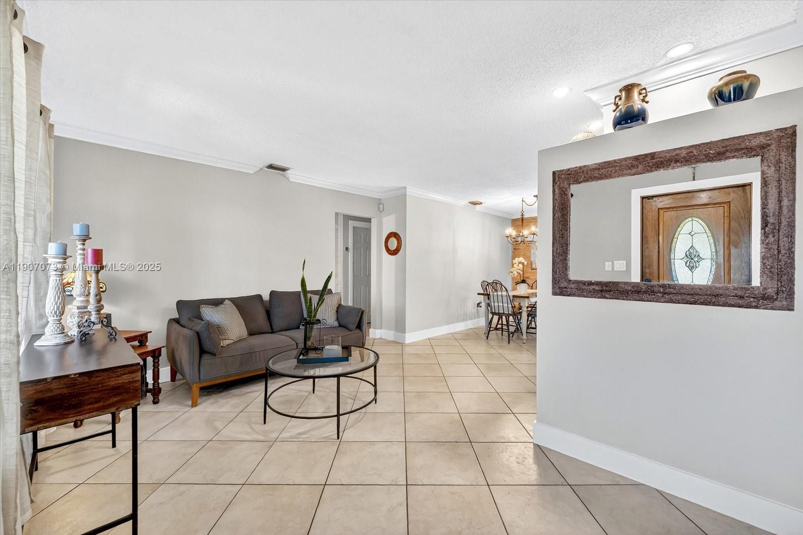 1300 West 77th Street Hialeah, FL 33014 - Photo 3 of 41 a living room with furniture and a fireplace