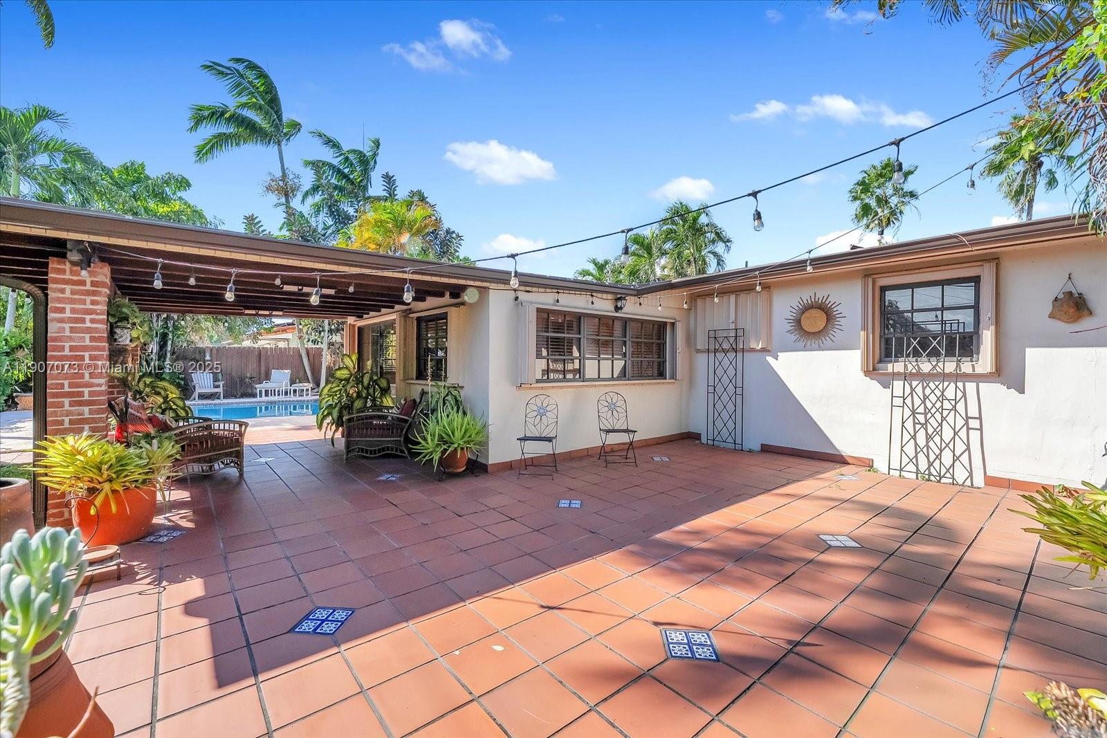1300 West 77th Street Hialeah, FL 33014 - Photo 31 of 41 a view of a house with a patio