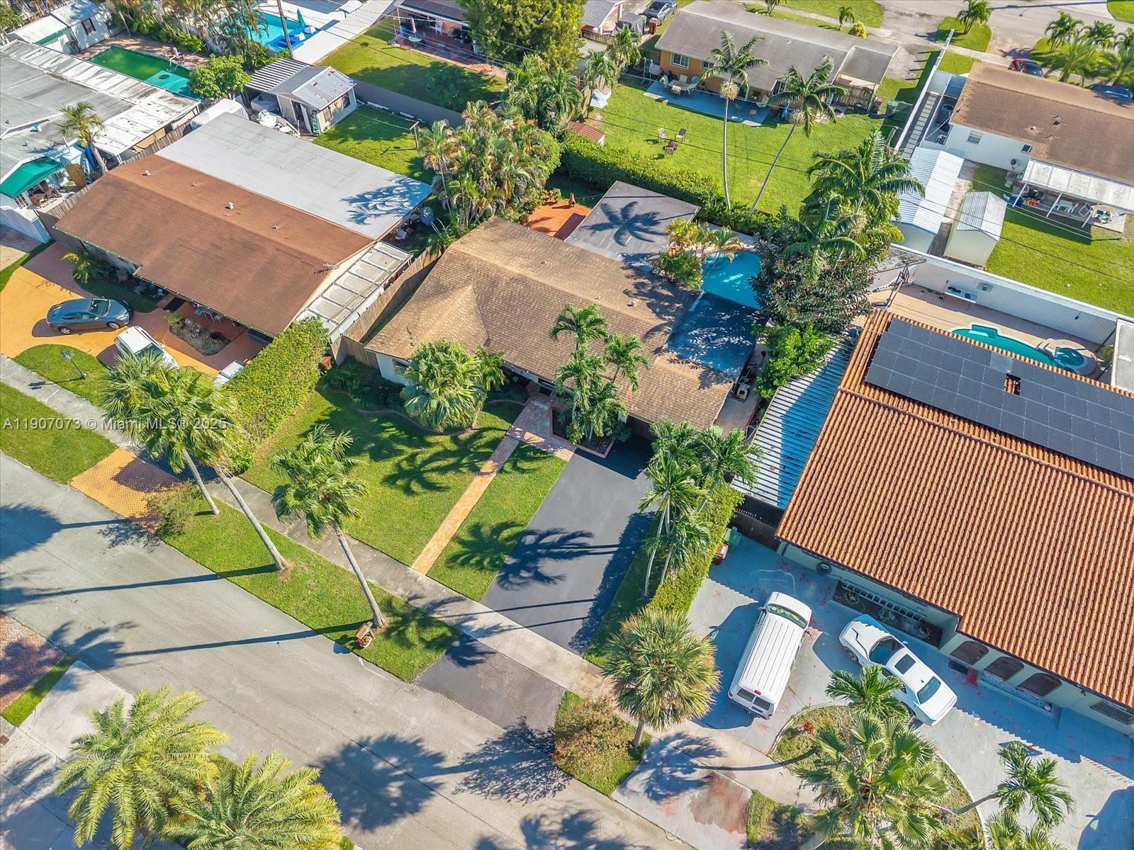 1300 West 77th Street Hialeah, FL 33014 - Photo 32 of 41 an aerial view of a house with a yard and potted plants