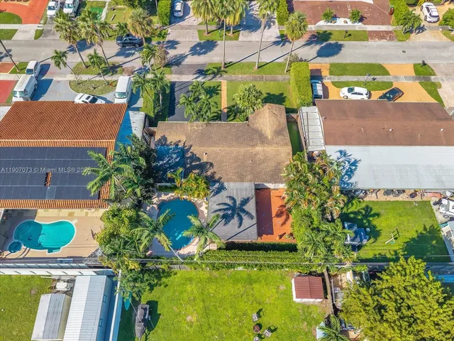 an aerial view of a house with a garden