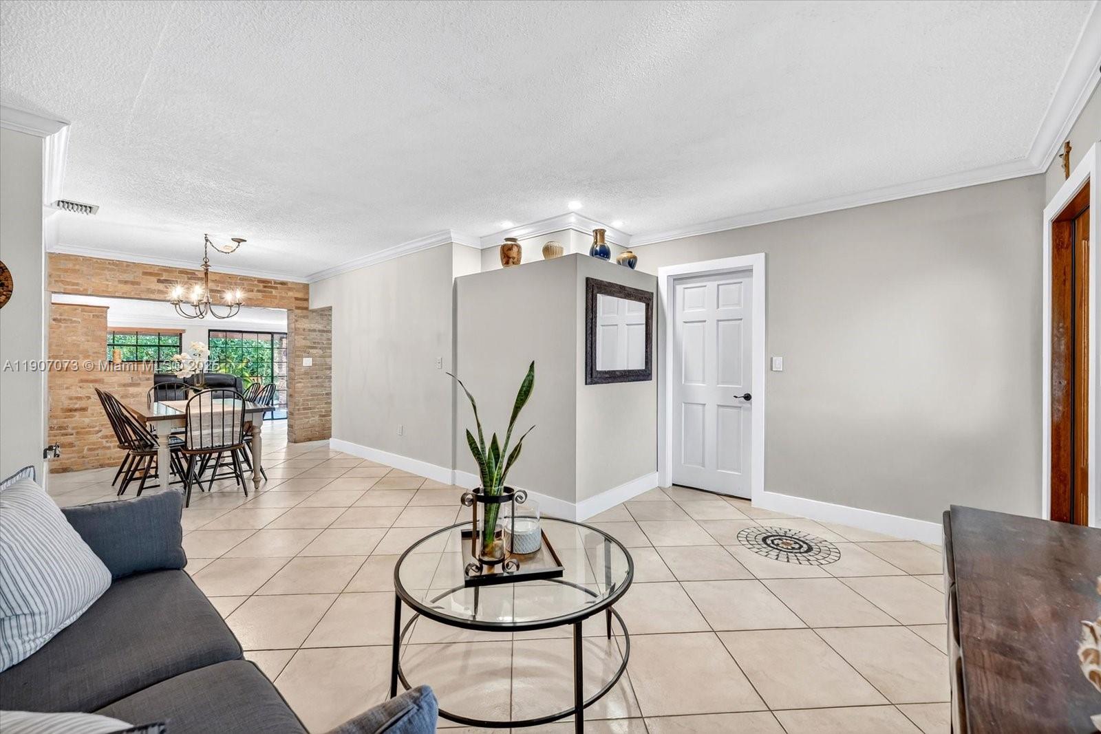 1300 West 77th Street Hialeah, FL 33014 - Photo 4 of 41 a living room with furniture and potted plant