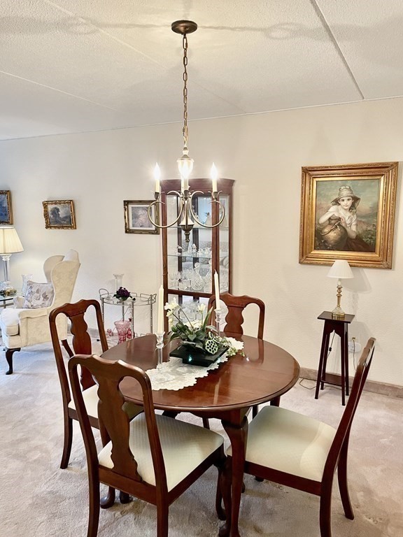 1550 Worcester Road, Unit 114 Framingham, MA 01702 - Photo 14 of 21 a view of a dining room with furniture
