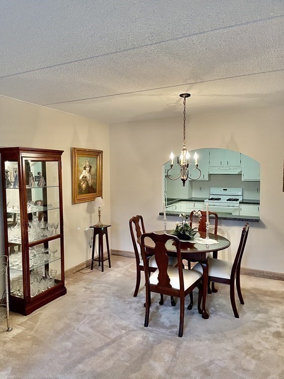 1550 Worcester Road, Unit 114 Framingham, MA 01702 - Photo 15 of 21 a dining room with furniture and window