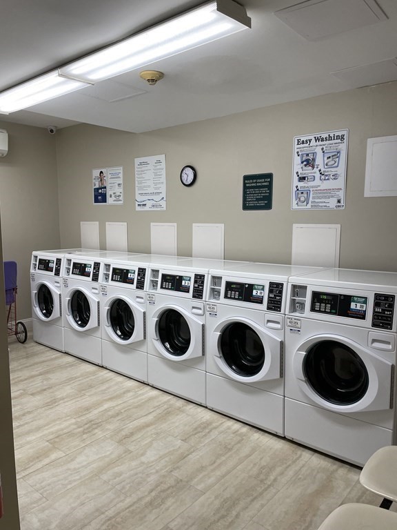 1550 Worcester Road, Unit 114 Framingham, MA 01702 - Photo 18 of 21 a utility room with dryer and washer