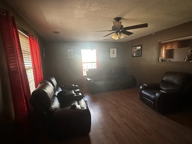 a view of a dining room with furniture and window