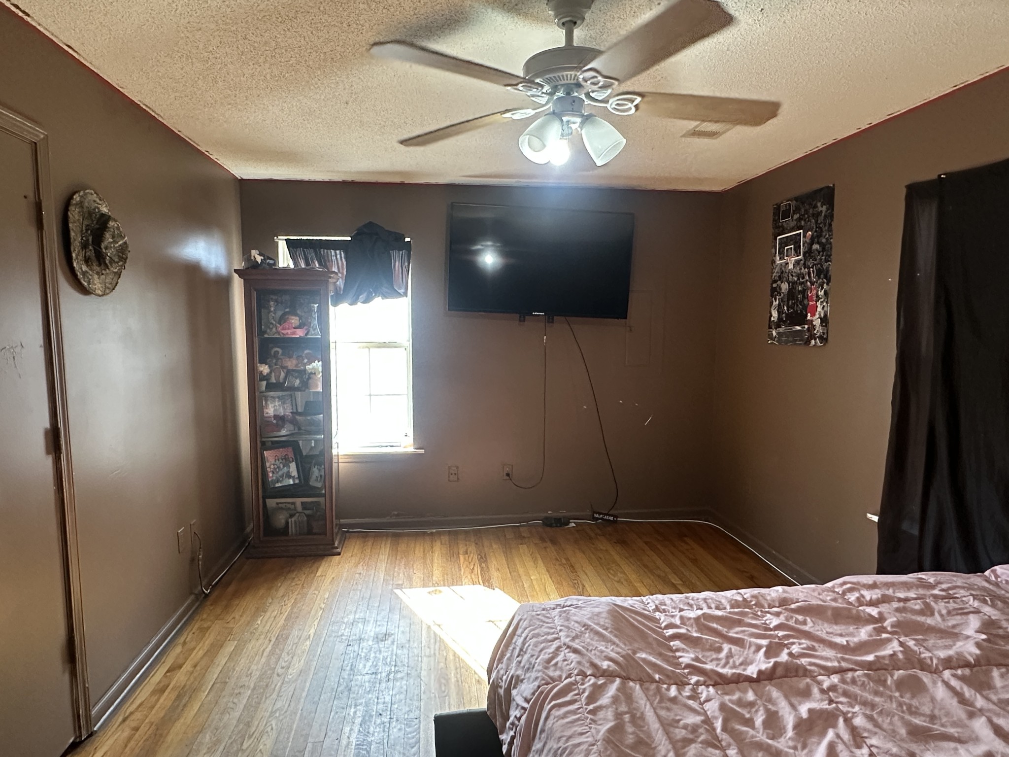 316 North High Street Covington, TN 38019 - Photo 5 of 14 a bedroom with a bed and a chandelier