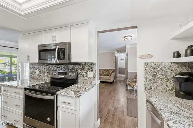 a kitchen with a stove and a microwave