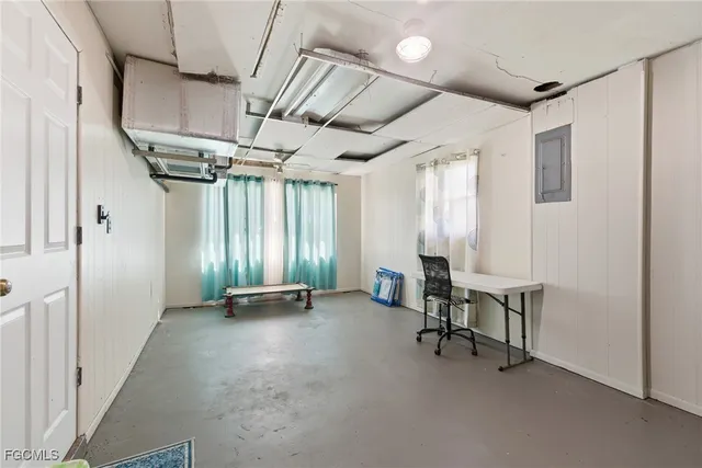 a view of backyard of house with green space