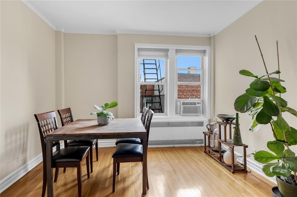 9281 Shore Road, Unit 608 Brooklyn, NY 11209 - Photo 2 of 13 a view of a dining room with furniture and a potted plant