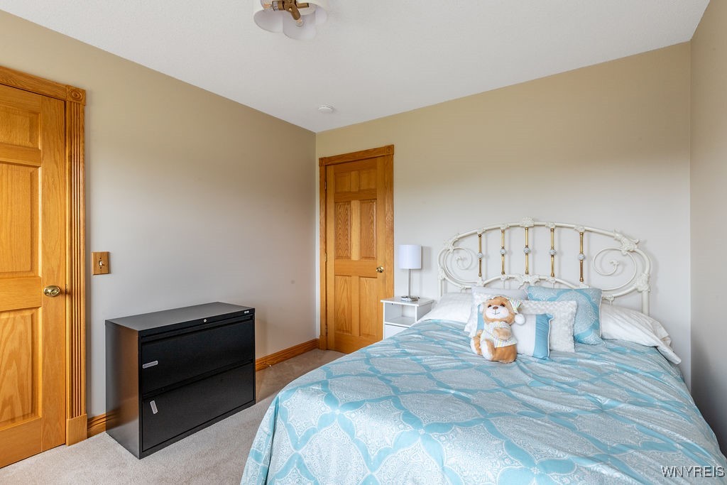 7960 Goodrich Road Clarence, NY 14032 - Photo 22 of 44 Front bedroom next to staircase and across from ma