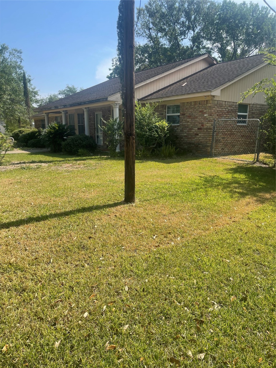 16719 McLean Road Pearland, TX 77584 - Photo 13 of 15 a view of swimming pool with lawn chairs and iron fence