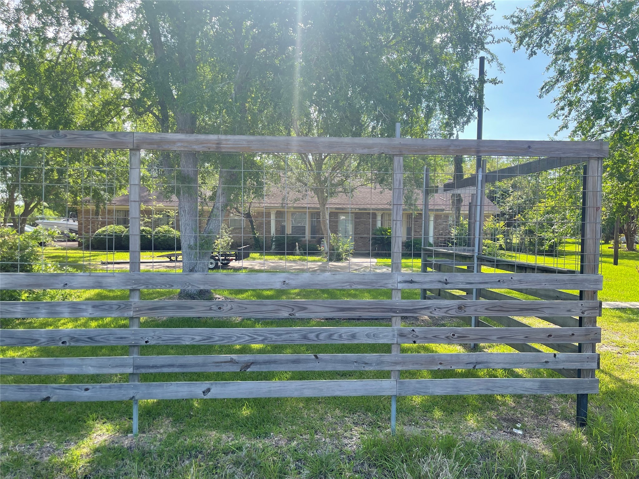 16719 McLean Road Pearland, TX 77584 - Photo 5 of 15 a front view of a house with a yard table and chairs