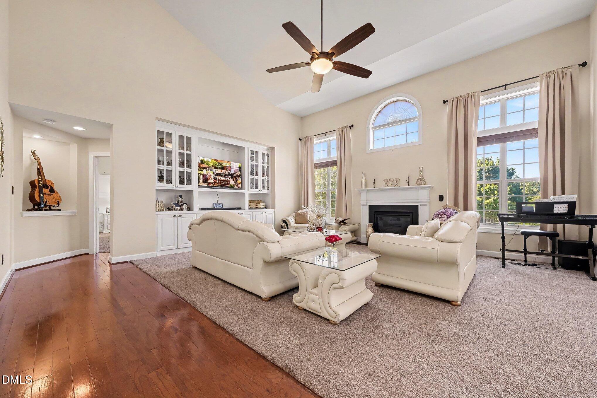 4000 Banks Stone Drive Raleigh, NC 27603 - Photo 9 of 60 a living room with furniture fireplace and a large window