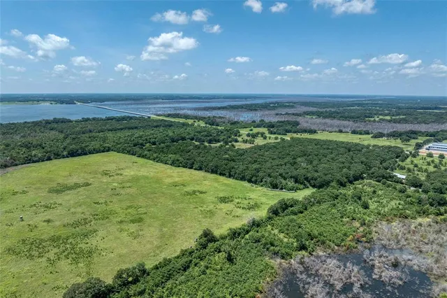 a view of a big yard with lots of green space and mountain view