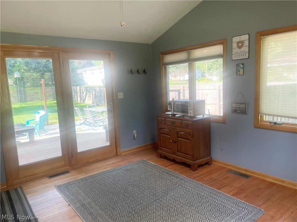 3047 Killian Road Uniontown, OH 44685 - Photo 29 of 36 Dining room with plenty of natural light, light hardwood / wood-style floors, and lofted ceiling