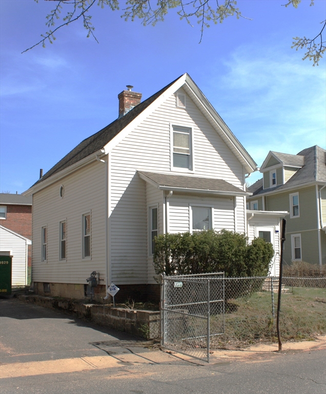 23 Foster Street Springfield, MA 01105 - Photo 1 of 15 a front view of a house with garage