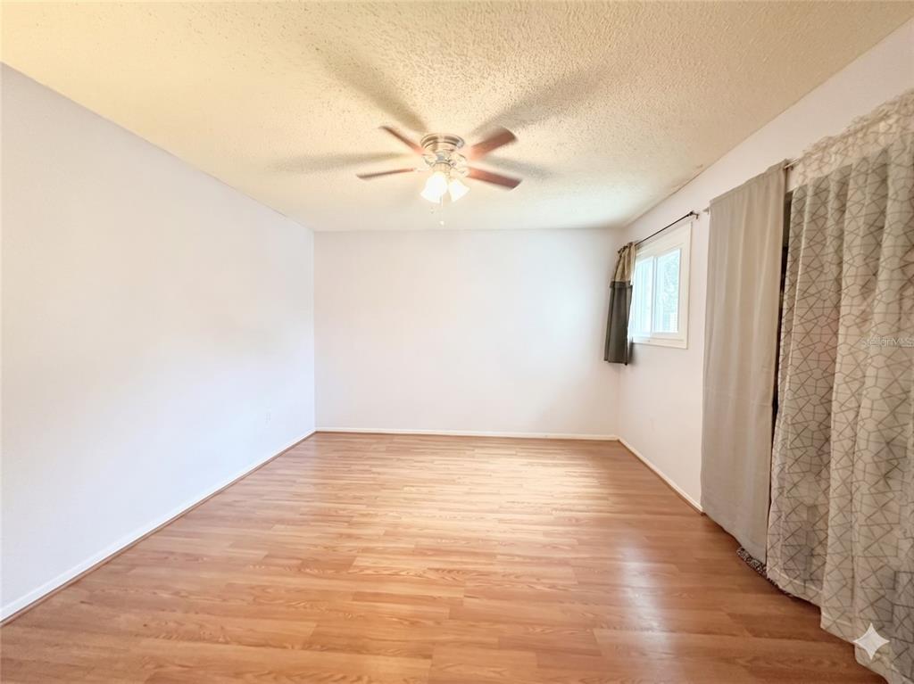912 Lake Destiny Road, Unit F Altamonte Springs, FL 32714 - Photo 8 of 12 a view of an empty room with wooden floor