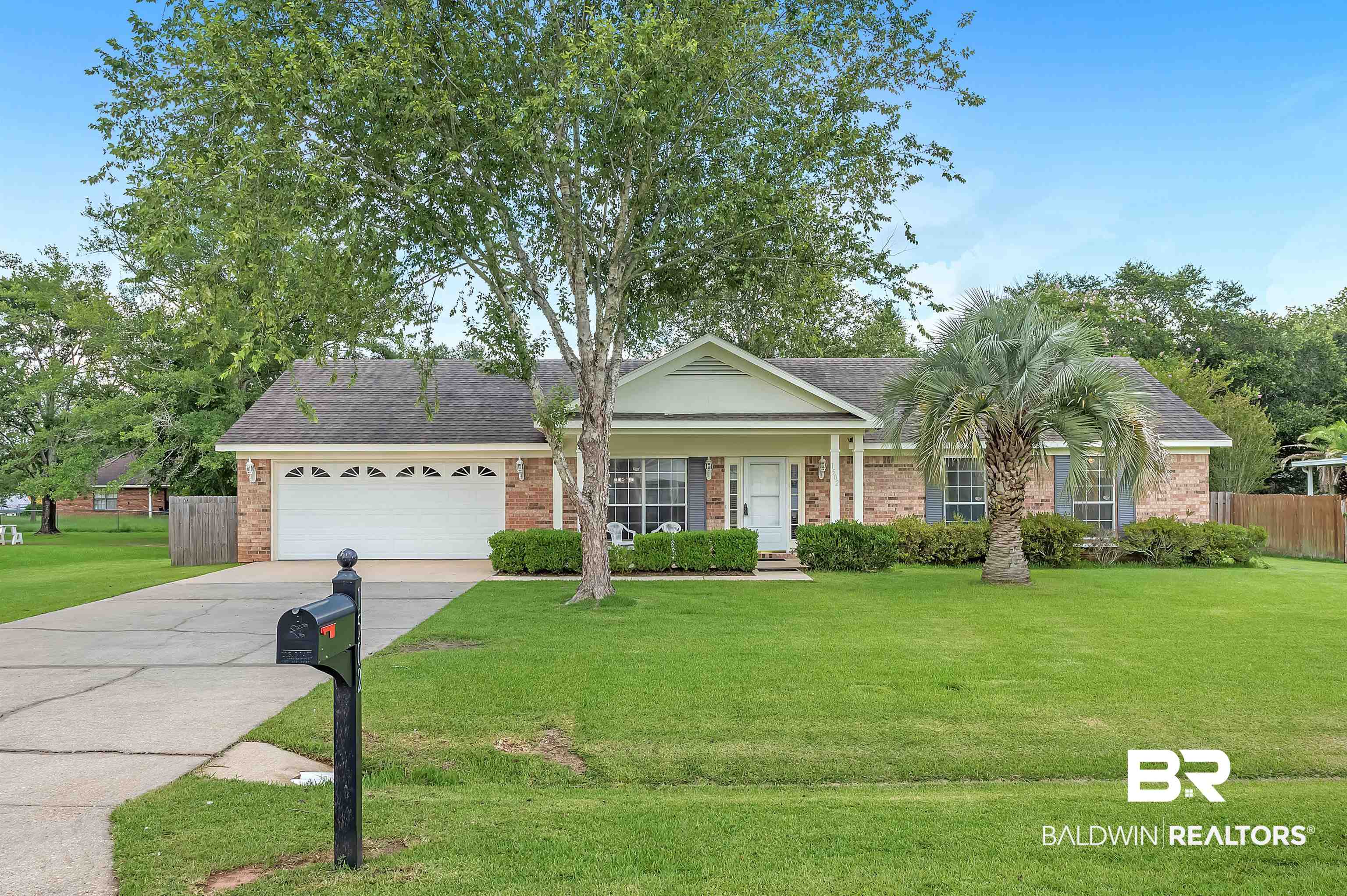1502 Mulberry Lane Foley, AL 36535 - Photo 3 of 45 Ranch-style house with a garage and a front yard
