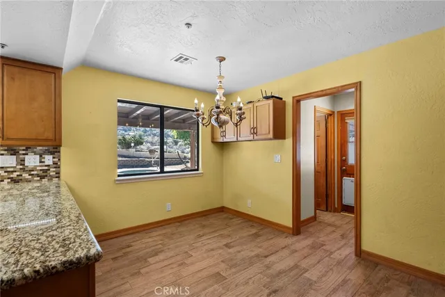 a view of livingroom with kitchen and window