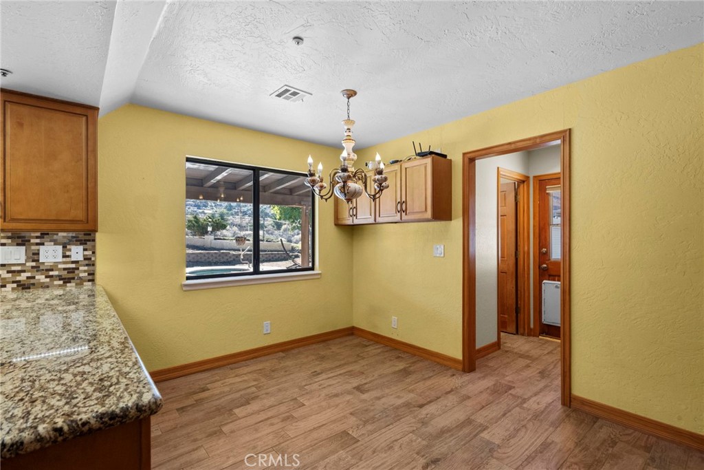 902 Searchlight Ranch Road Acton, CA 93510 - Photo 12 of 52 a view of livingroom with kitchen and window