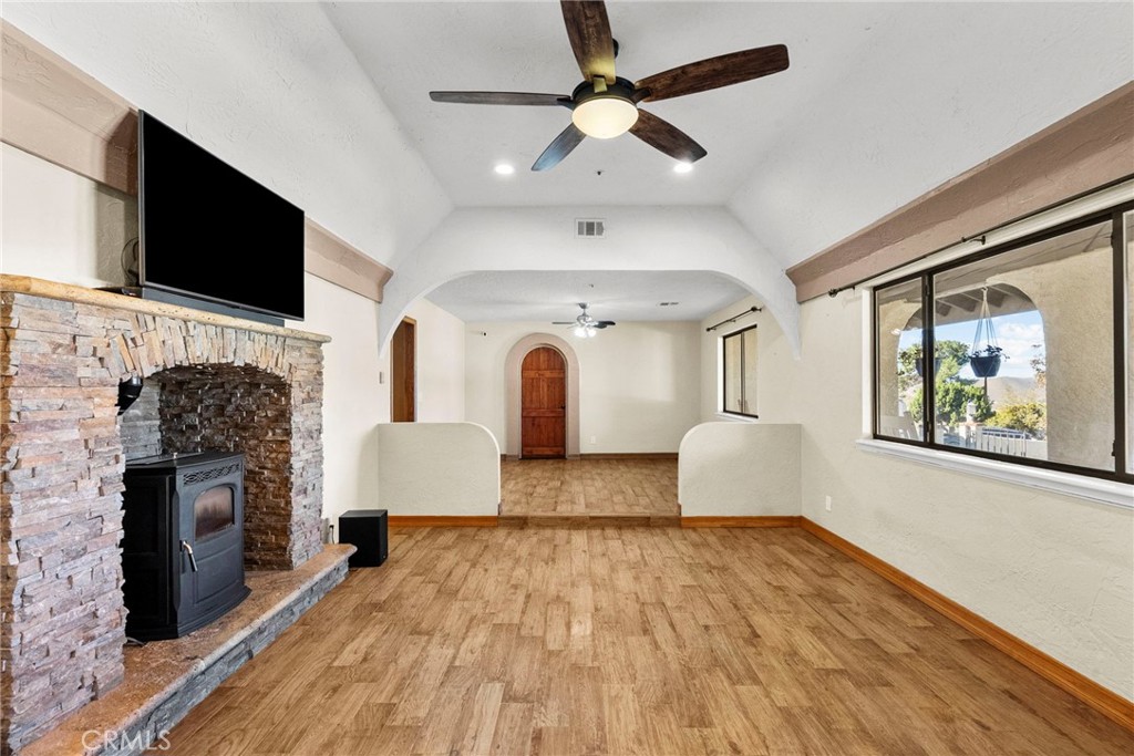 902 Searchlight Ranch Road Acton, CA 93510 - Photo 14 of 52 a living room with fireplace furniture and a flat screen tv